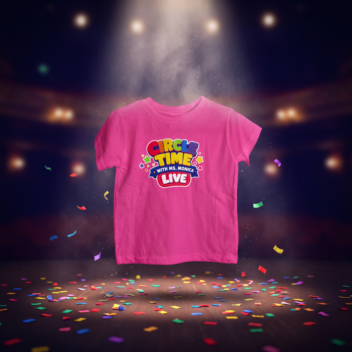 Hot Pink Circle Time with Ms. Monica LIVE toddler tee under a stage spotlight