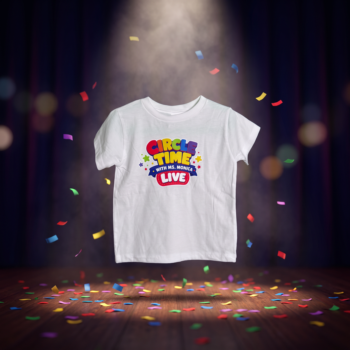 White Circle Time with Ms. Monica LIVE toddler tee under a stage spotlight