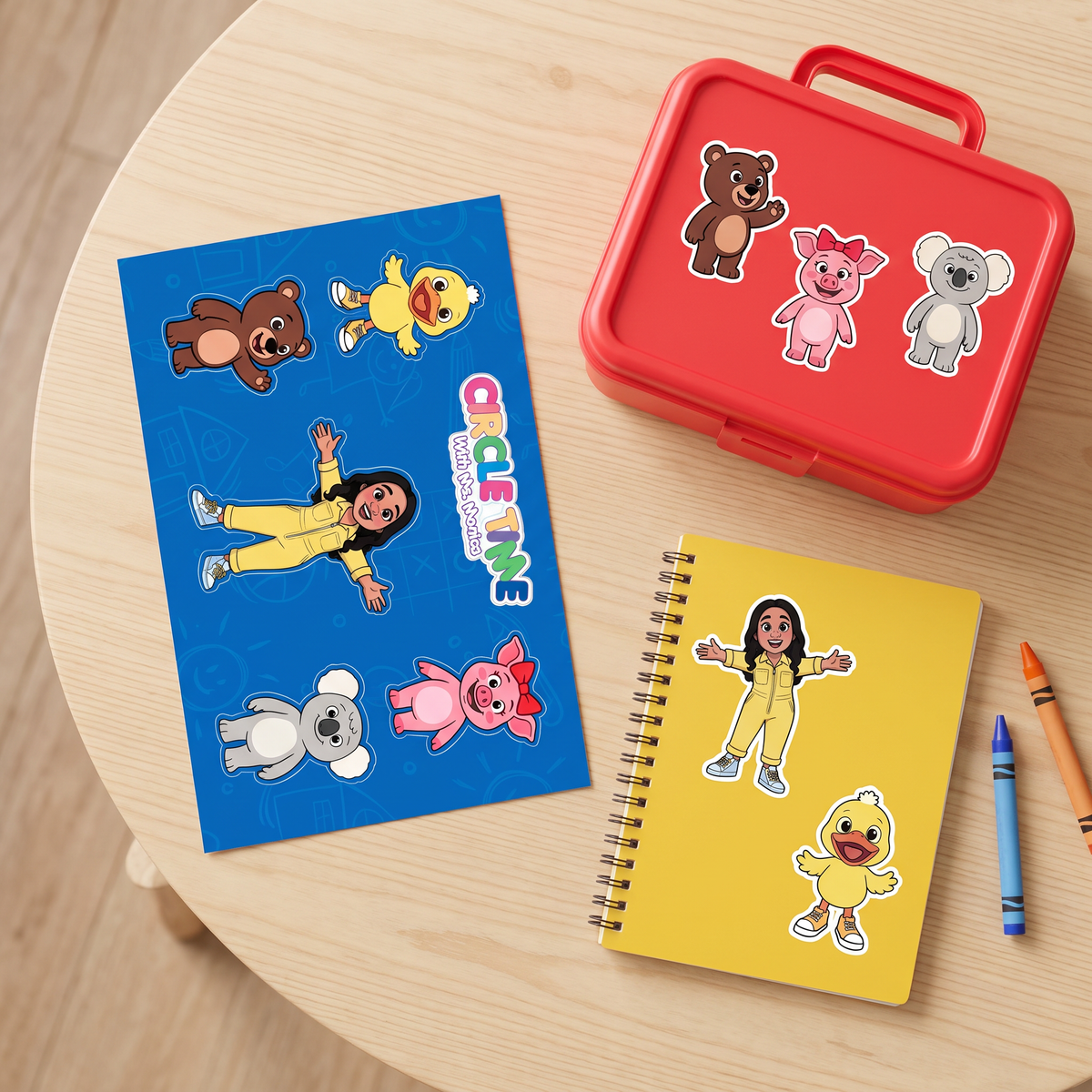 Circle Time with Ms. Monica sticker sheet beside a lunchbox and notebook decorated with character stickers